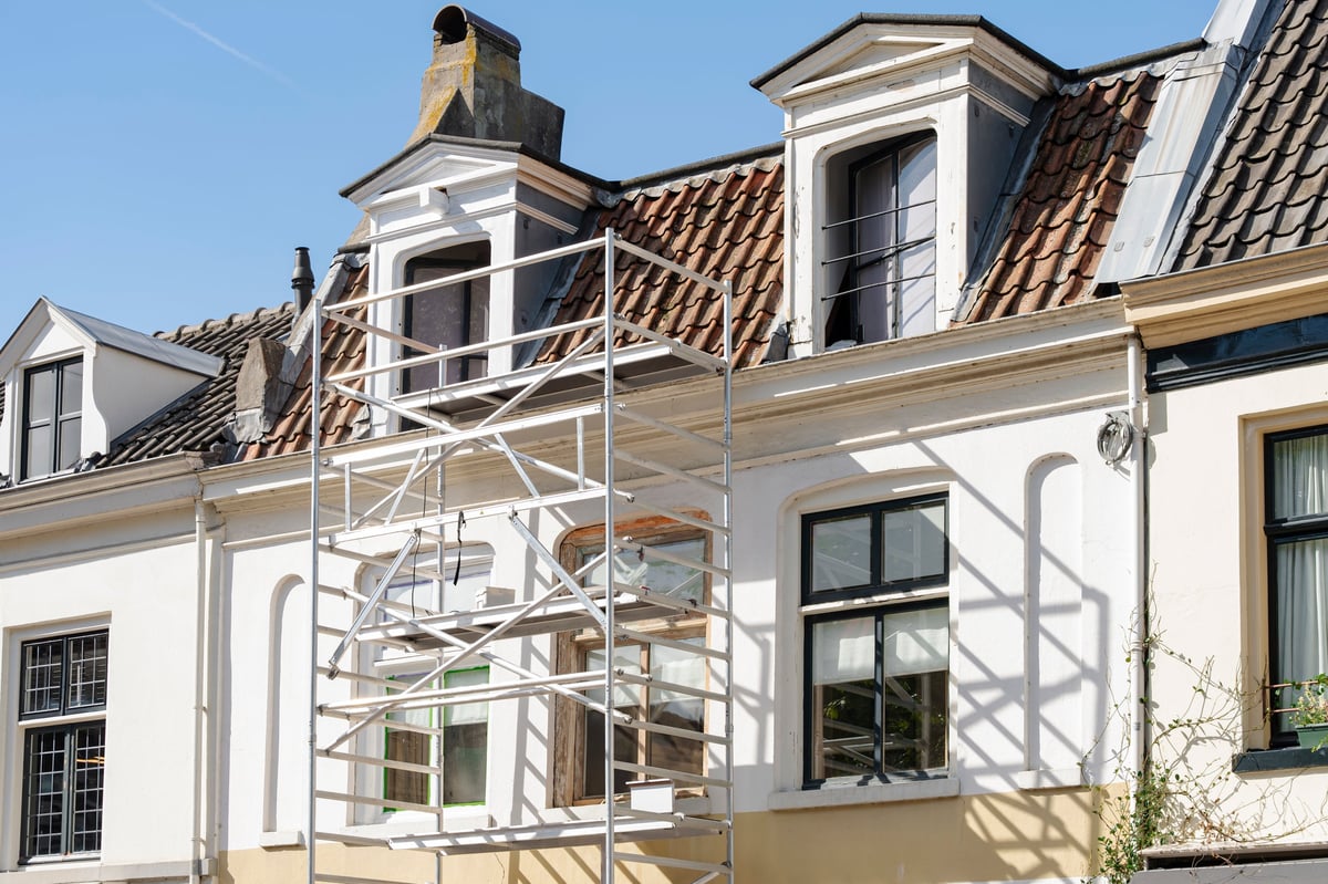 Scaffolding erected against a professional building for exterior maintenance